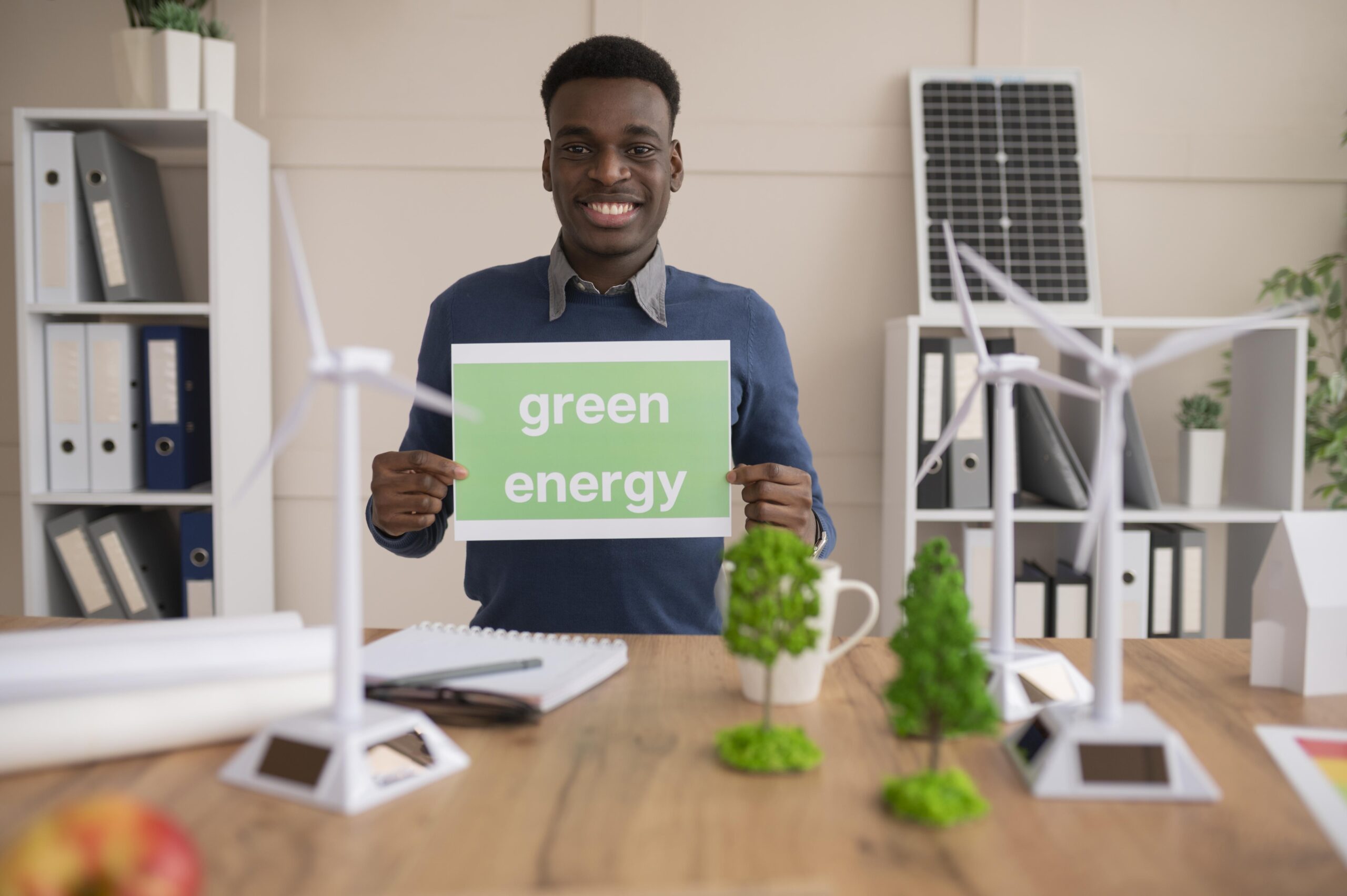 man-holding-paper-with-green-energy